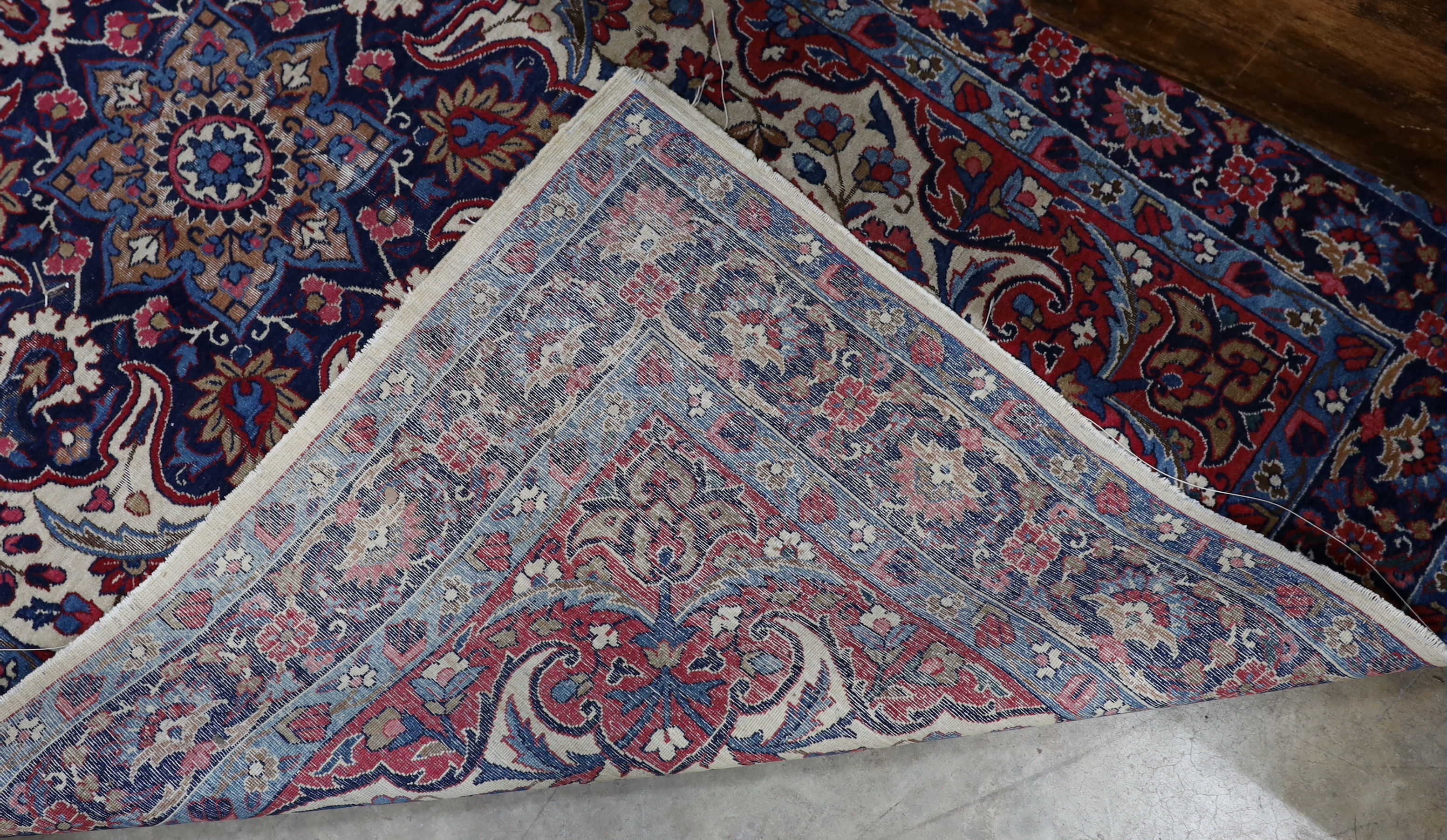 A North West Persian ivory ground rug, 205 x 118cm